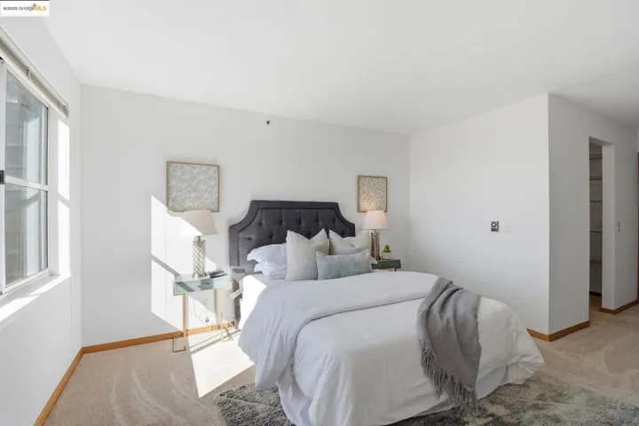 Bedroom featuring carpet floors and baseboards