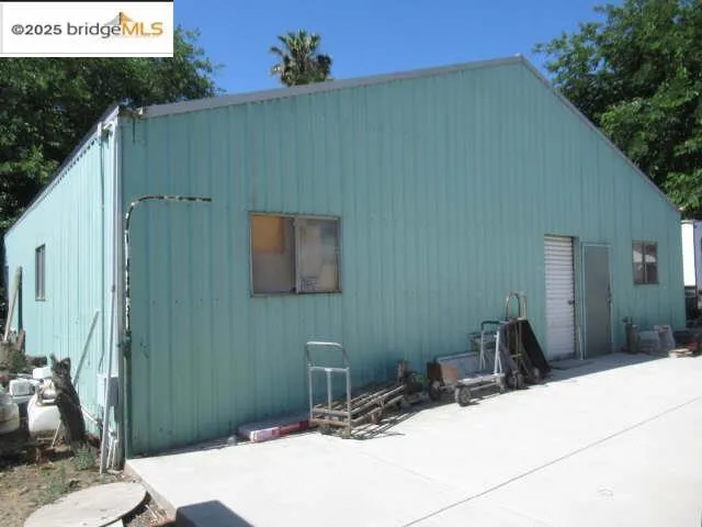Back of house with a patio