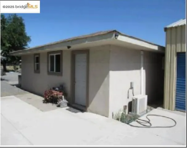 View of side of home with stucco siding