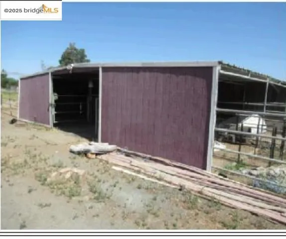 View of outbuilding featuring an exterior structure