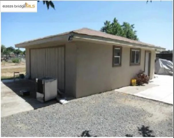 View of property exterior with stucco siding