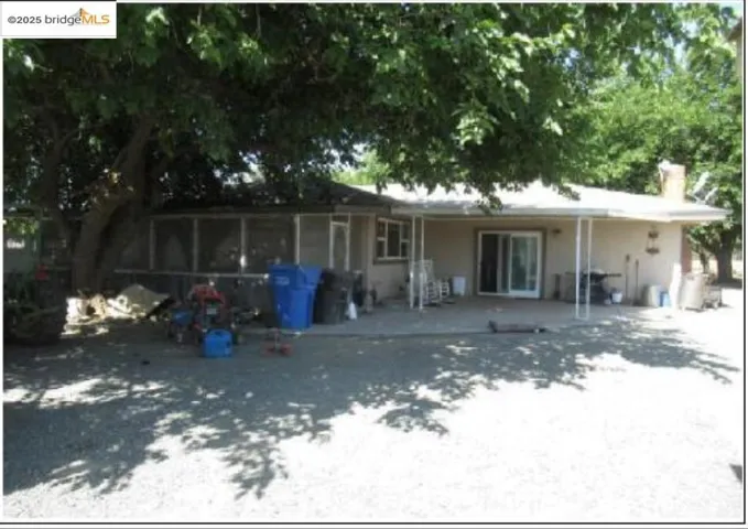 Back of property featuring a patio area and a chimney