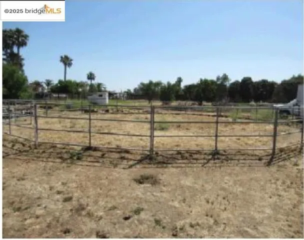 View of yard with a rural view