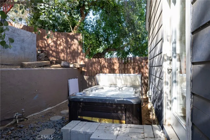 Spa off backyard and off Primary Suite