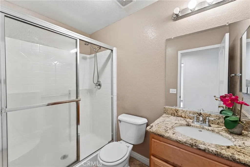 Main-level full bathroom perfect for guests or family