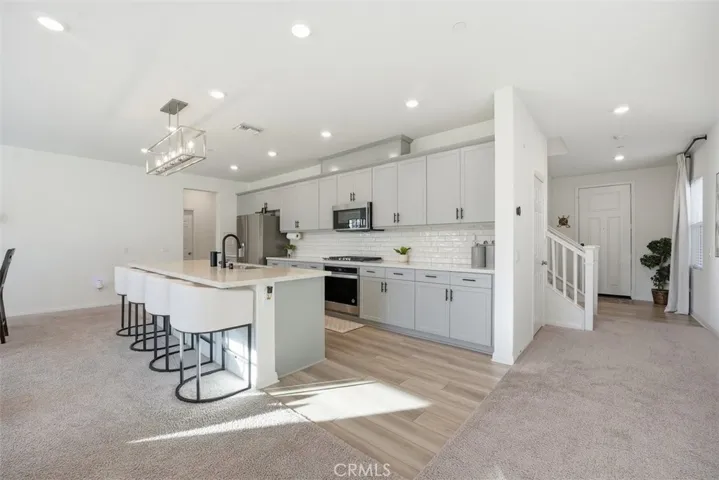 Open concept kitchen with 10 Ft island.  Quartz countertops