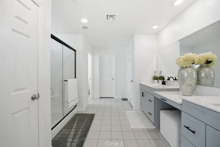 Primary bathroom:  Dual sinks, built-in make-up vanity.  Plenty of storage.
