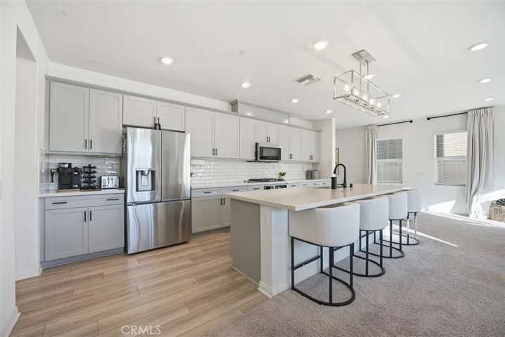 Abundance of cabinetry with upgraded backsplash