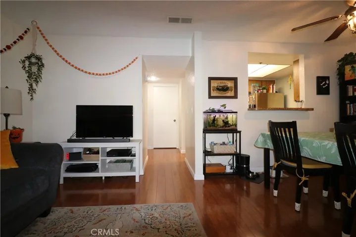 Living room towards kitchen and bedroom