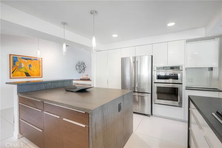 Kitchen island offers sitting area on left side of island, generous storage thru-out kitchen