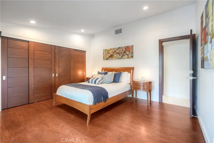 Third guest room provides beautiful wood flooring & wardrobe doors, this room opens to pool & spa area