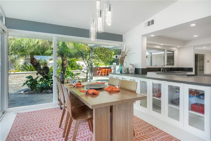Dining room looks out to pool & spa