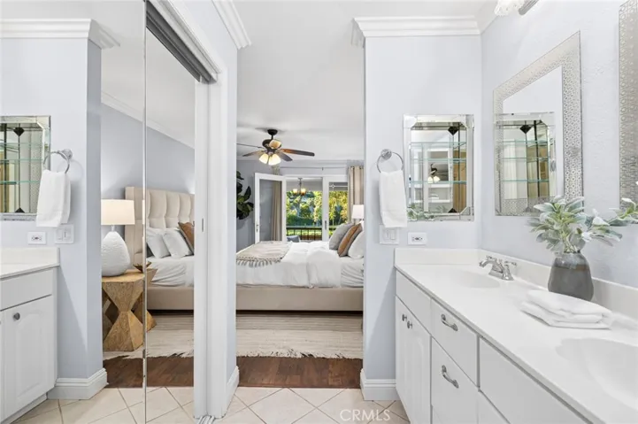 Mirrored closet doors open to large walk-in closet