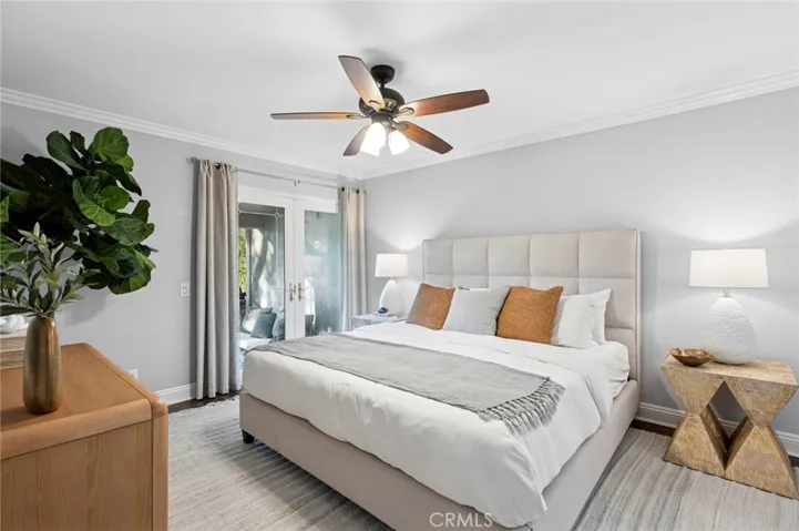 Large primary suite w/ crown molding, ceiling fan, new interior paint