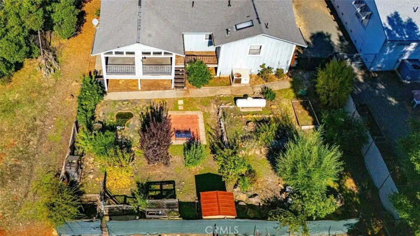 Drone view of backyard and koi pond.