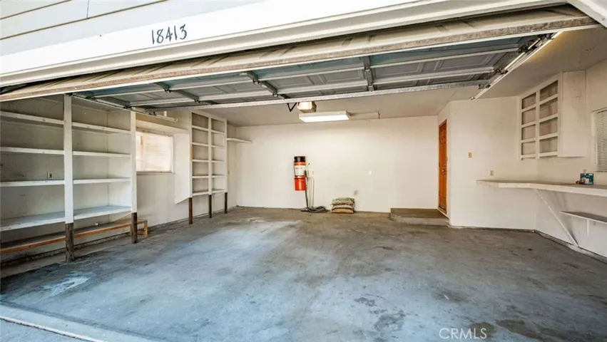 Two car garage with storage and whole house vaccum.