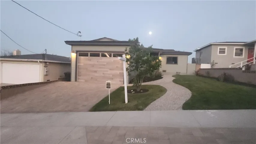 New curbside pavers to compliment the driveway and home.