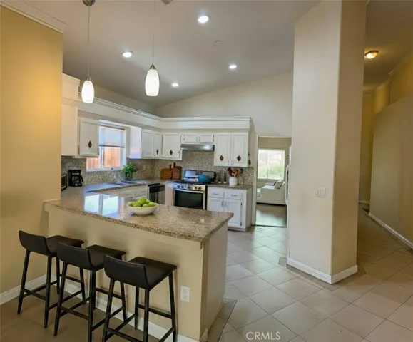 view to kitchen from family room- Virtually staged
