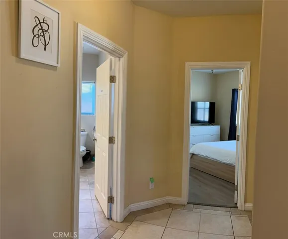 Hallway to 2nd Bath and bedrooms.   Virtually furnished