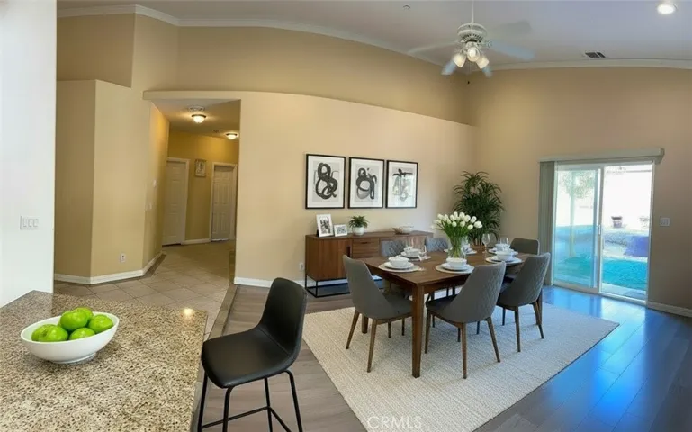 view from the kitchen to the family room- virtually furnished