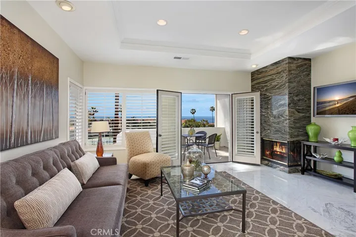 Gorgeous light filled, ocean and Catalina Island views from your private balcony. (PHOTO FROM PRIOR STAGING) HOME HAS BEEN PAINTED. VIEWS BEST IN OLDER PHOTOS - Some trees have grown taller at resort.