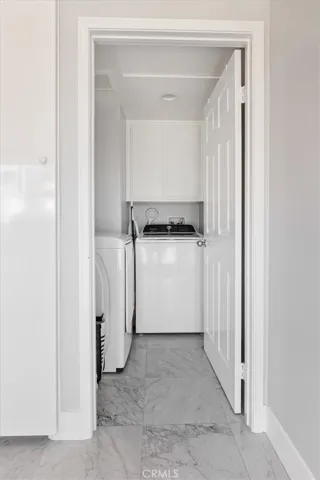 Interior Laundry room with washer and dryer.