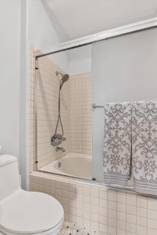 Bathtub and shower with skylight.