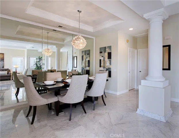 Beautiful light and bright condominium with mirrored walls in dining room and marble flooring. (PHOTO FROM PRIOR STAGING HOME HAS BEEN PAINTED WITH NEW BASEBOARDS)