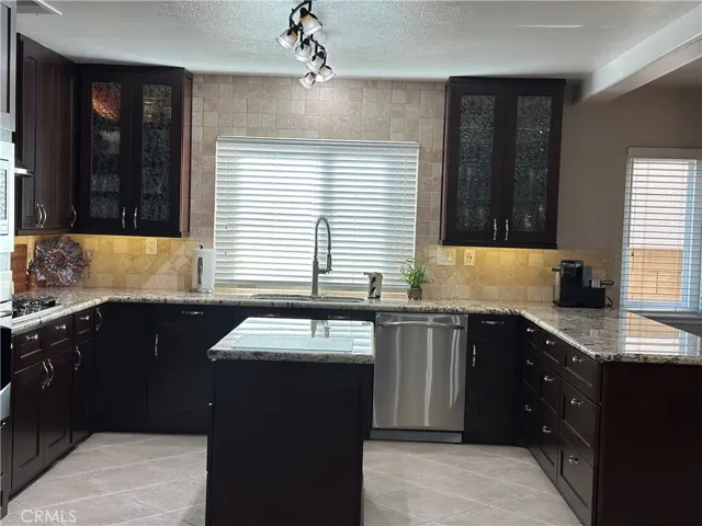 Front view  to show dishwasher custom glass cabinets with inside lights