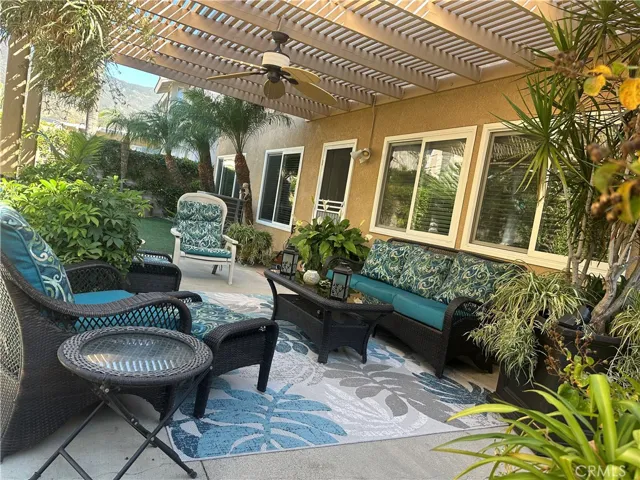  lattice patio with ceiling fan on concrete