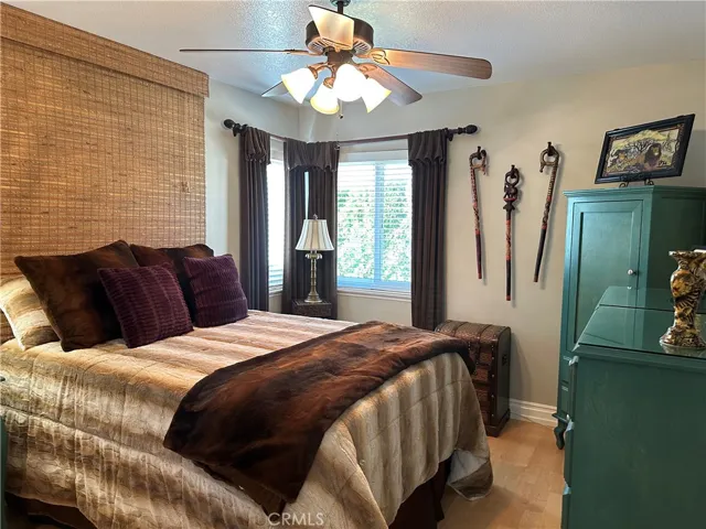 different view  bedroom three and ceiling fan