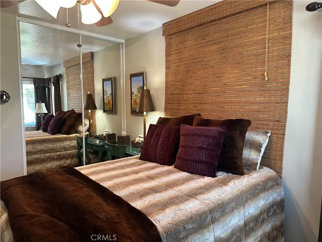  view of sliding mirror door sunshade alo include  ceiling fan