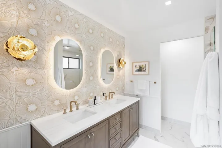 Serene modern baths with layered lighting that feels like a private spa.