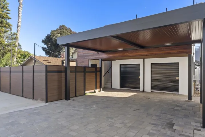 2 covered carports alongside 2 guest parking spots.