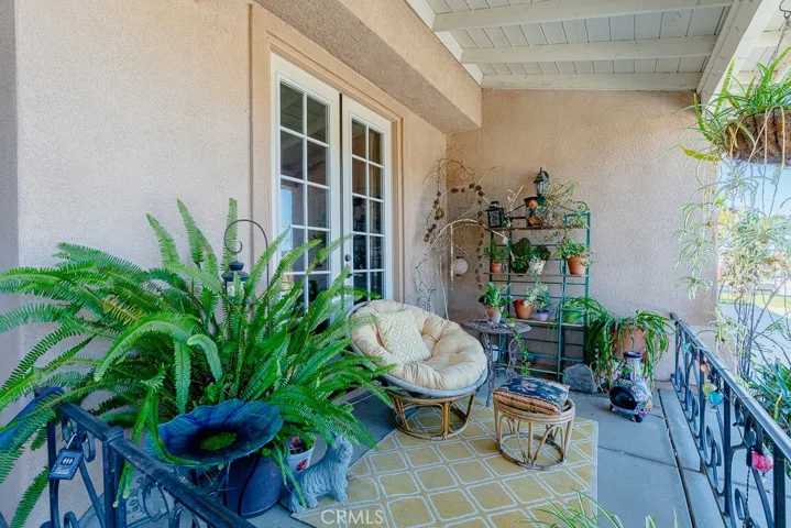 “Just off the French doors, a charming sitting area offers the perfect spot for morning coffee.”