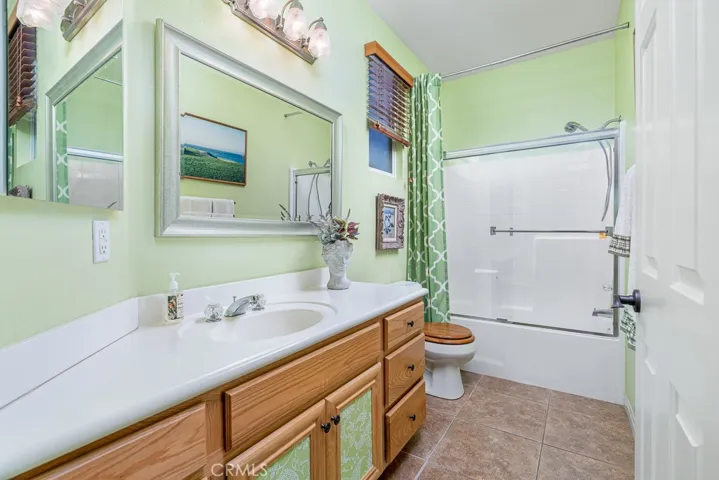A third bathroom features a tub/shower and a single vanity, providing convenience and comfort for your guests.