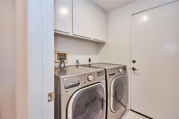 Laundry Area with built-in cabinets