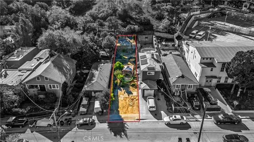 Red Outline;Property lot extends all the way up to the bushes on 2nd Elevation, by Chain link Fence.