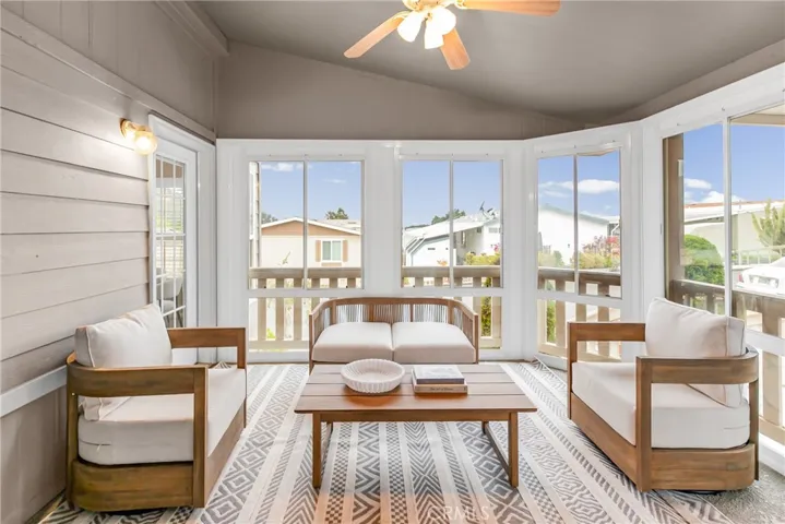 Welcoming enclosed sunroom at the entryway