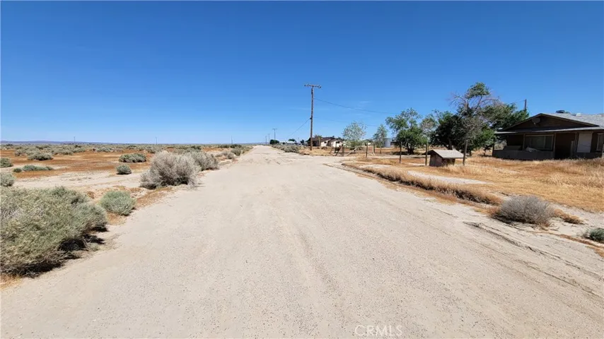 NEIGHBORS TO IMMEDIATE LEFT OF VACANT LOT ON  B12  ROAD
