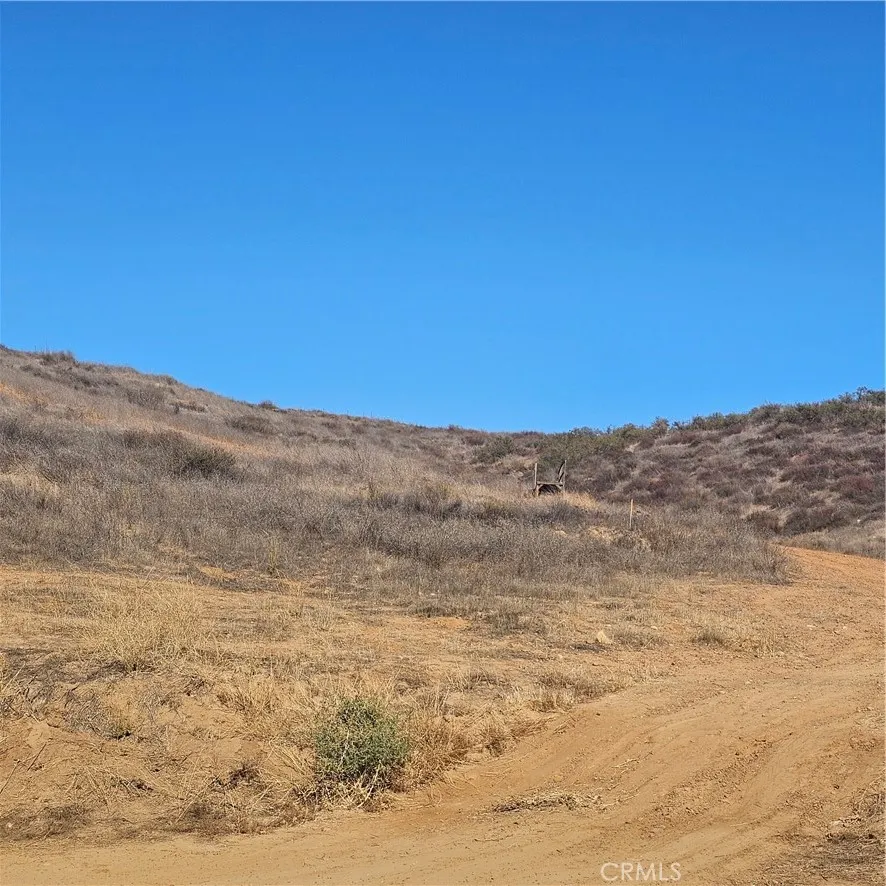 Dirt Path Leading Upwards Near The Edge Of One Of The Lots.  ( There Seems To Be Some Stakes Around These Lots. Buyer To Verify If They Surround Both Lots )