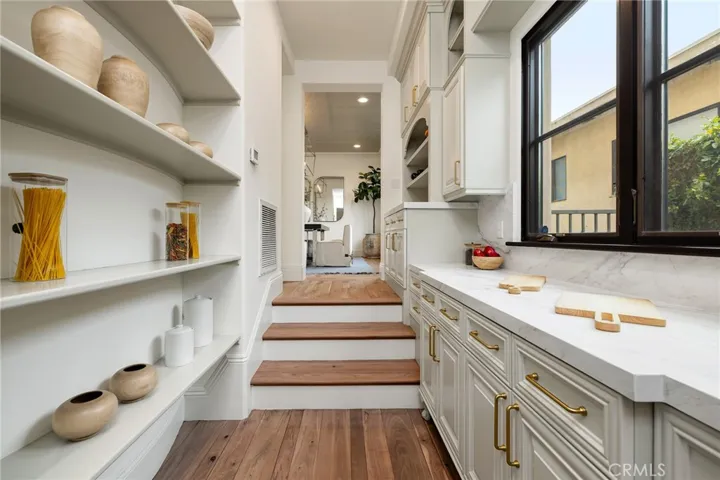 Butler's pantry with walk-in pantry