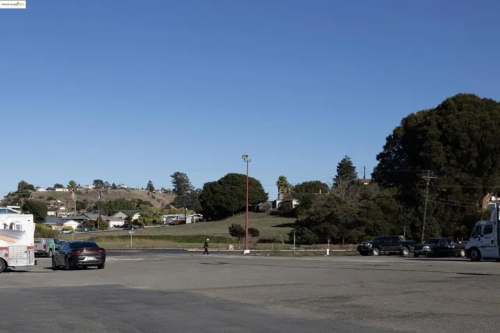 View of asphalt street with street lighting