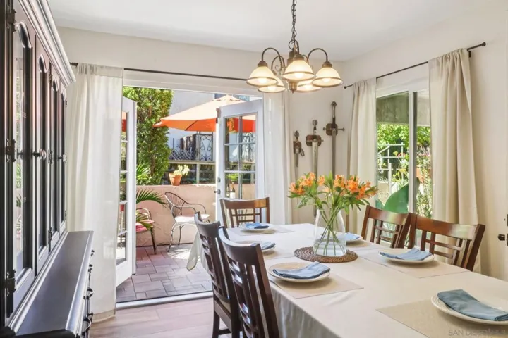 Elegant main dining area with French doors that extend gatherings outdoors, creating seamless indoor-outdoor living
