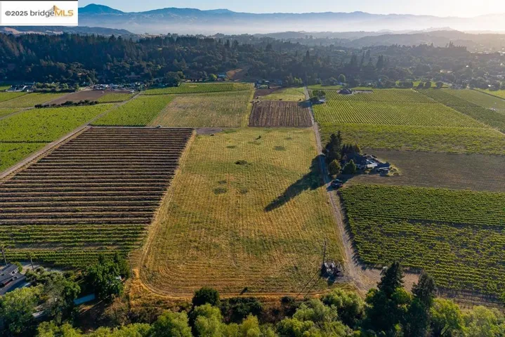 View of property location featuring a mountainous background and rural landscape