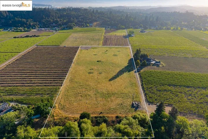 Overview of rural landscape featuring property boundaries highlighted and extensive farmland