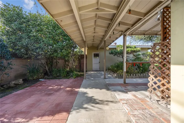 The covered walkway to the garage at 10357 Lesterford Avenue