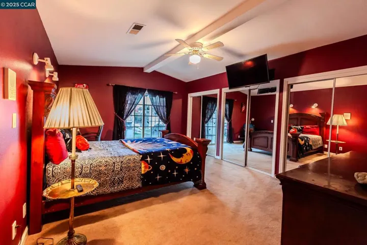 Large mirrored closets with built-in custom drawers.
