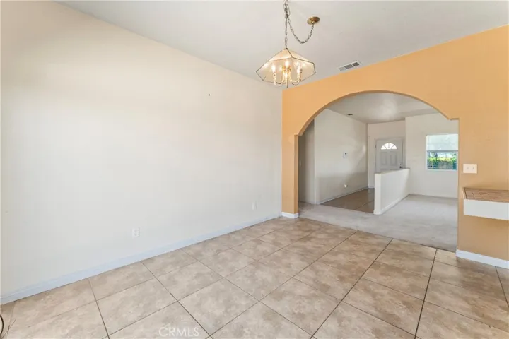 Dining Area Looking into Foyer and Living Room