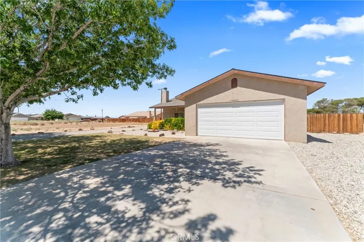 Front of Garage, Extra long Driveway, Opener. Additional Parking on Right side of Garage for RV / Trailer